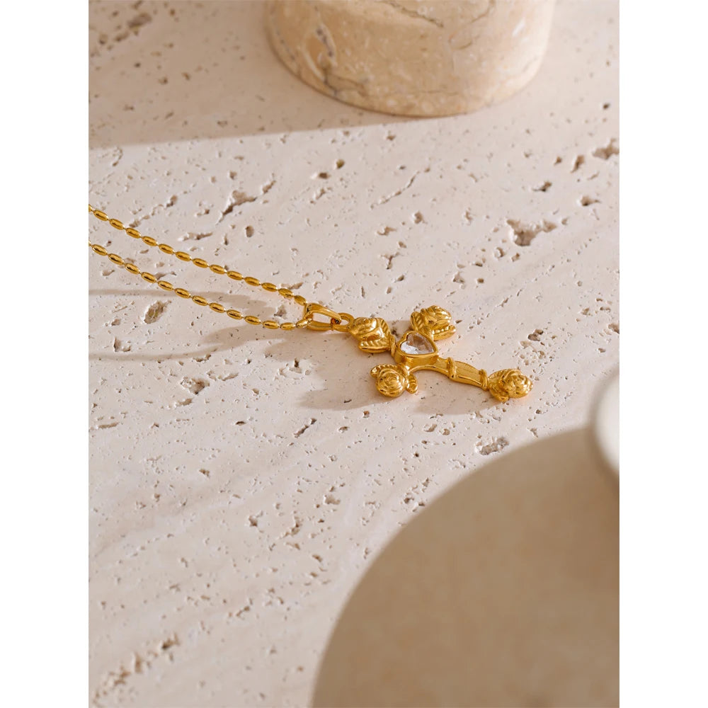 AMI CROSS NECKLACE